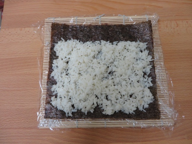 Spread rice on nori